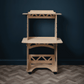 Animation of different desk configurations of a birch plywood stand up/sit down desk on a herringbone wood floor against a dark blue wall.