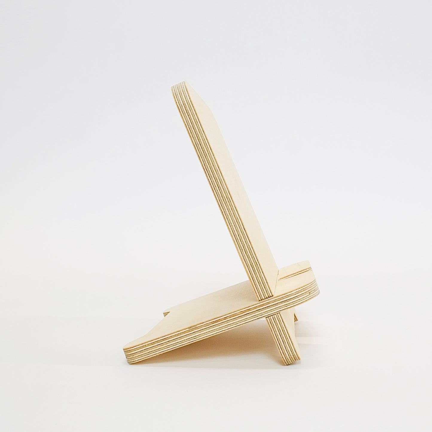 Side view of plywood tablet stand showing plywood layers.