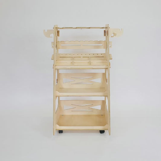 180 degree animation of birch plywood tool trolley with 3 shelving trays & various tool storage cutouts on wheels shot on white background